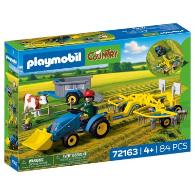 Petit tracteur avec andaineur &agrave; foin